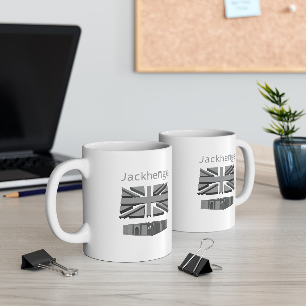 Two Jckhenge mugs on a desk